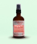Bild einer 250 ml Flasche von Ohanic Miracle Treatment 10 Actions Leave-In. Die braune Flasche hat einen schwarzen Pumpspender und ein Etikett in rosa und weiß. Das Produkt enthält Traubenextrakt und Abyssinian-Öl, ist vegan und besteht zu 100% aus natürlichen Ursprungs-Extrakten. Es ist frei von Sulfaten, Silikonen, Farbstoffen, PEG-S, Salz und Gluten. Auf dem Etikett steht 'Miracle Treatment 10 Actions', 'Leave-In Treatment', 'Grape Extract & Abyssinian Oil'
