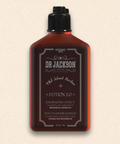 Bild einer 200 ml Flasche von Dr. Jackson Old School Barber Potion 1.0 Energizing Effect Shampoo. Die braune Flasche hat ein klassisches Design mit schwarzem Klappdeckel und weißer Schrift. Das Shampoo enthält botanische Extrakte und ist sowohl für Haar als auch für Körper geeignet. Auf der Flasche steht in mehreren Sprachen 'Energizing Effect Shampoo for Hair & Body Botanical Extracts' und 'Efecto Energizante Champú para Cabello & Cuerpo Extractos Botánicos'