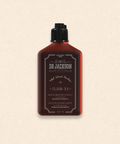Bild einer 200 ml Flasche von Dr. Jackson Old School Barber Elixir 3.1 Invigorating Effect Conditioner. Die braune Flasche hat ein klassisches Design mit schwarzem Klappdeckel und weißer Schrift. Dieser Conditioner enthält botanische Extrakte und bietet einen belebenden Effekt. Auf der Flasche steht in mehreren Sprachen 'Invigorating Effect Conditioner Botanical Extracts' und 'Efecto Estimulante Acondicionador Extractos Botánicos'
