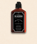 Bild einer 100 ml Flasche von Dr. Jackson Old School Barber Potion 1.0 Energizing Effect Shampoo. Die braune Flasche hat ein klassisches Design mit schwarzem Klappdeckel und weißer Schrift. Das Shampoo enthält botanische Extrakte und ist sowohl für Haar als auch für Körper geeignet. Auf der Flasche steht in mehreren Sprachen 'Energizing Effect Shampoo for Hair & Body Botanical Extracts' und 'Efecto Energizante Champú para Cabello & Cuerpo Extractos Botánicos'